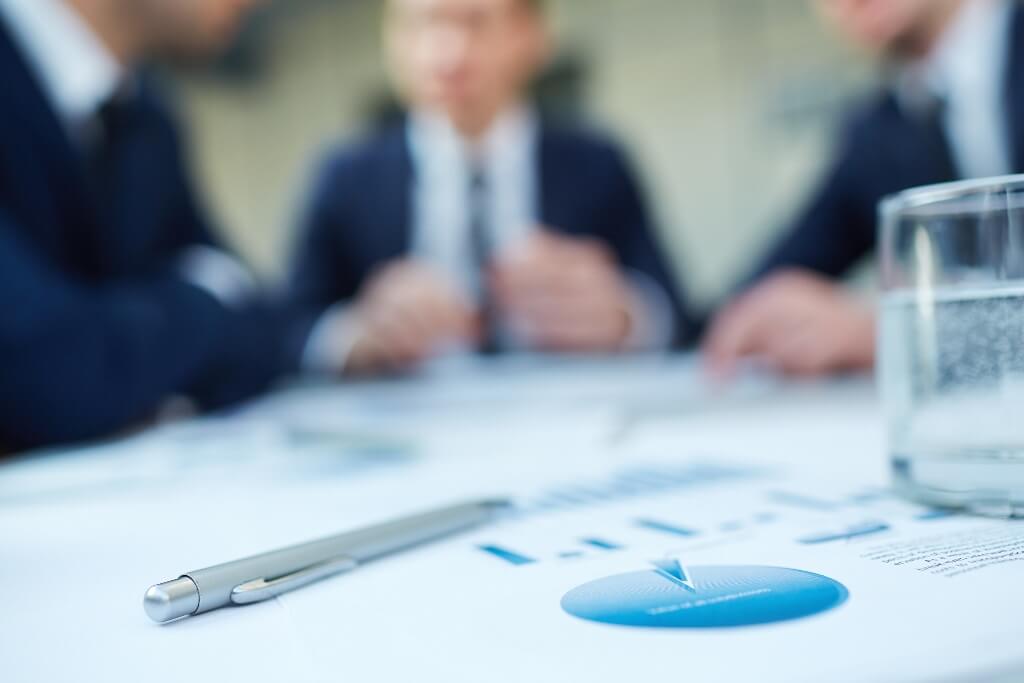 Men in suits around a table