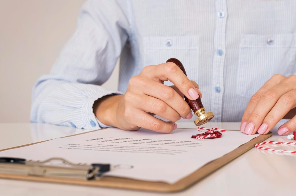 Person wax sealing a document