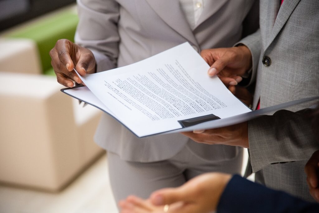Business Partners Reading Commercial Contract Together