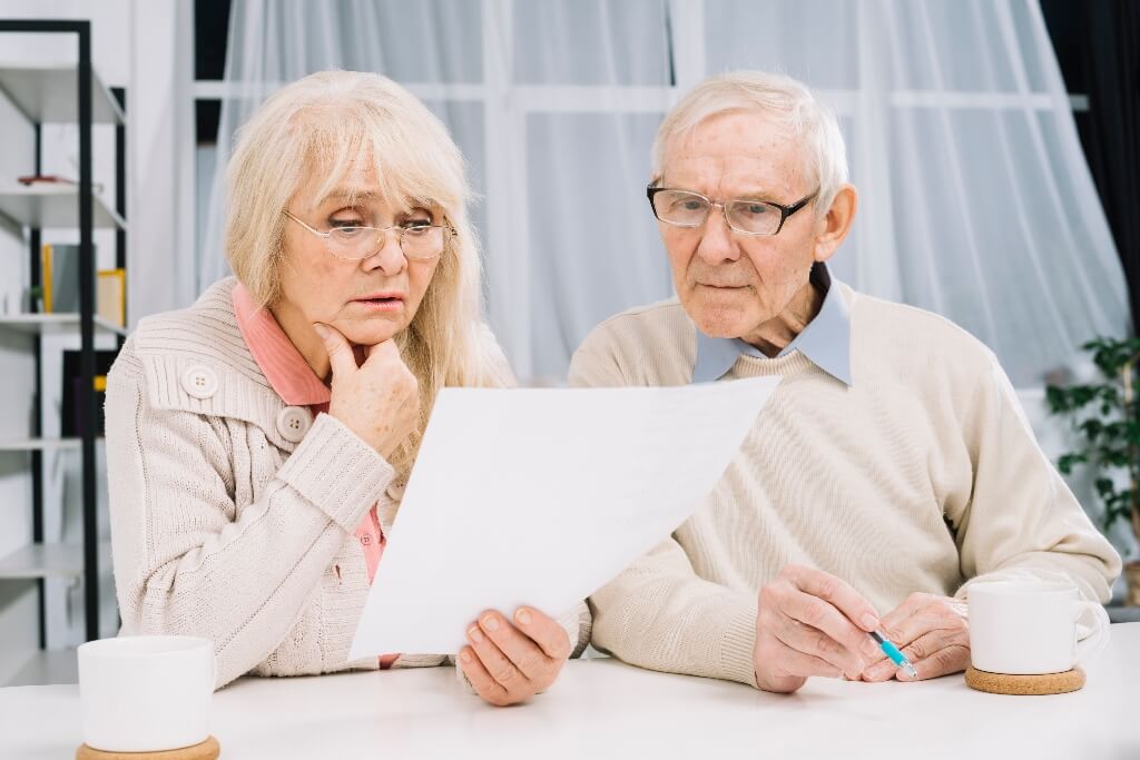 Contesting Your Parents Will - An Elderly Couple looking over their Will